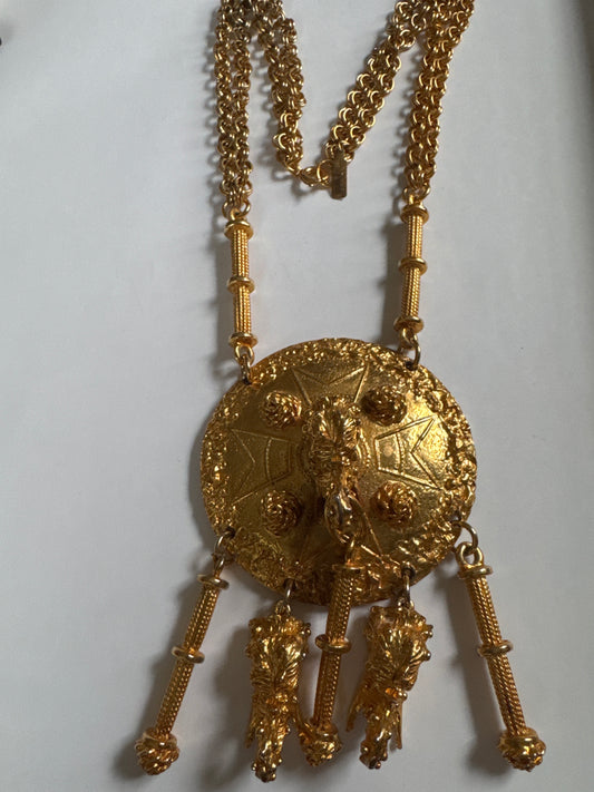 Signed 1960s Pauline Rader signed gold tone necklace. The two elephant heads that dangle at the bottom of the pendant are hollow. Double chains on each side. It's heavy!
