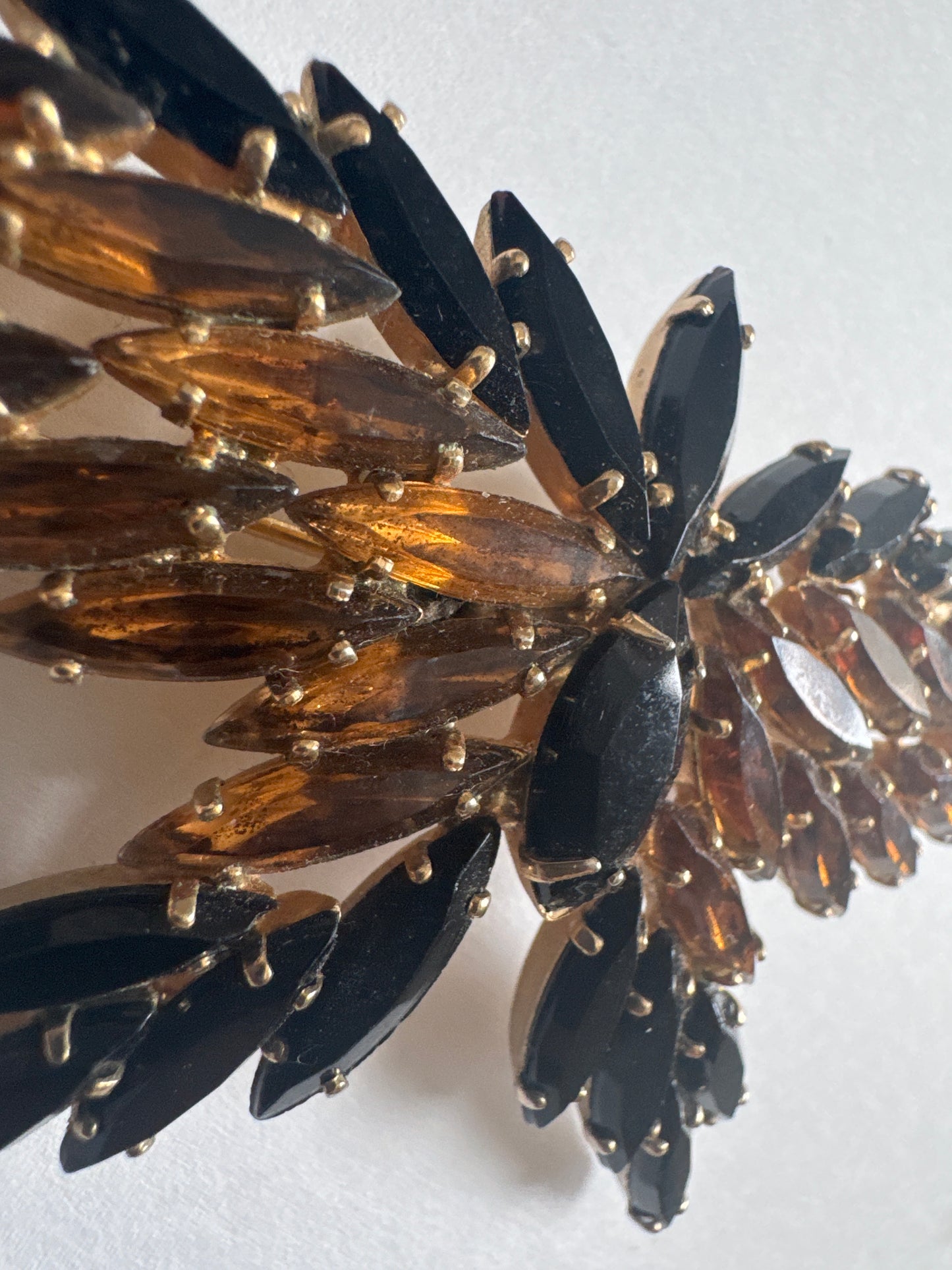 Beautiful 1950s D & E butterfly navette brooch featuring black and amber colored rhinestones