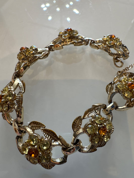 1960s signed CORO rhinestone bracelet with yellow and amber colored stones