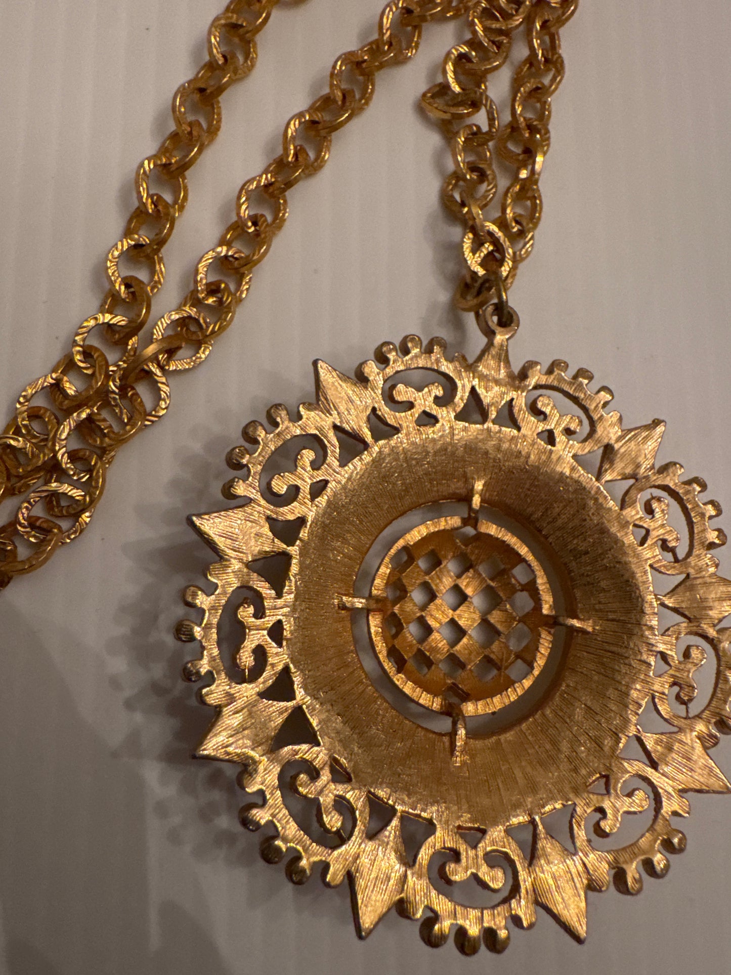 Vintage 1970s pendant necklace, gold tone disc
