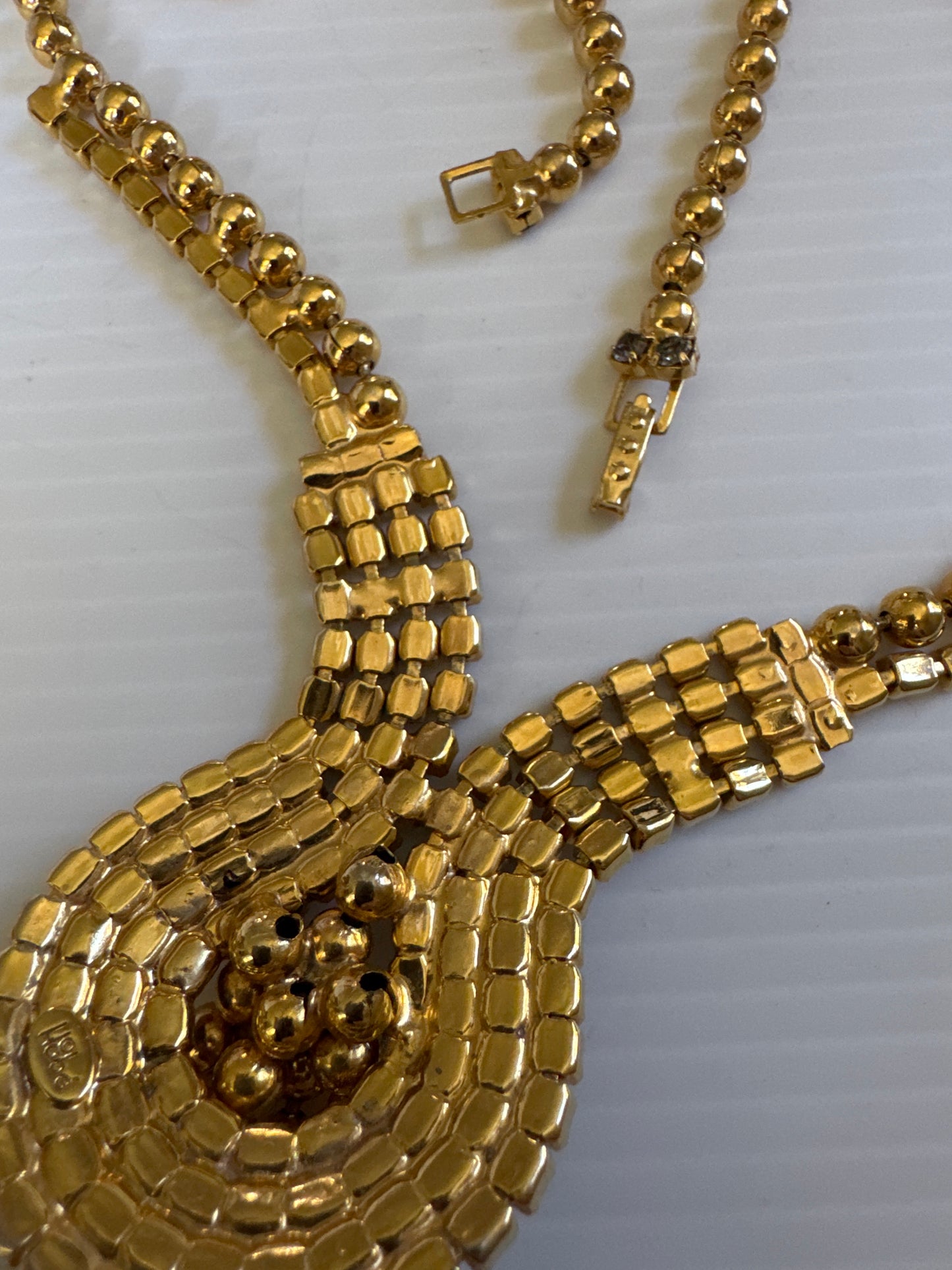 vintage necklace with gray and clear, rhinestones and gold tone ball tassel
