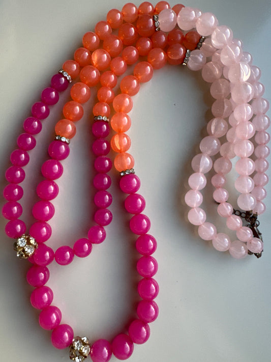 Beautiful 1950s beaded necklace with pink coral and light pink beads and rhinestone beads separating each color. Tom.
