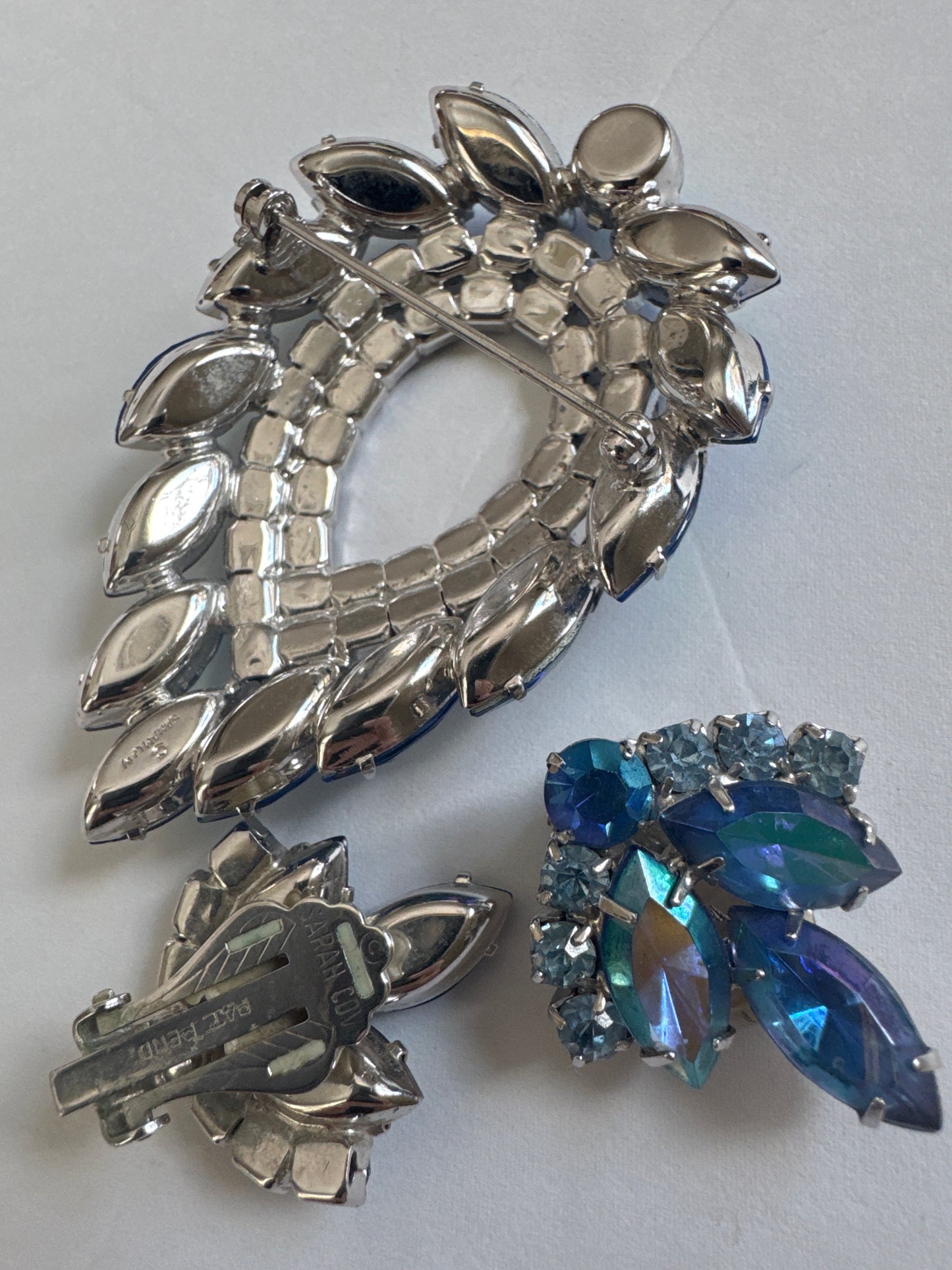 Beautiful vintage signed Sarah  Coventry blue rhinestone brooch and earring set manufactured by D & E