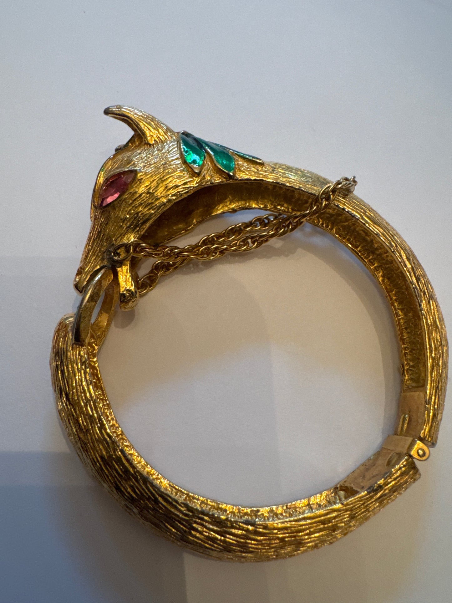 Vintage gold plate and enamel horse clamper bracelet with pink rhinestone eyes