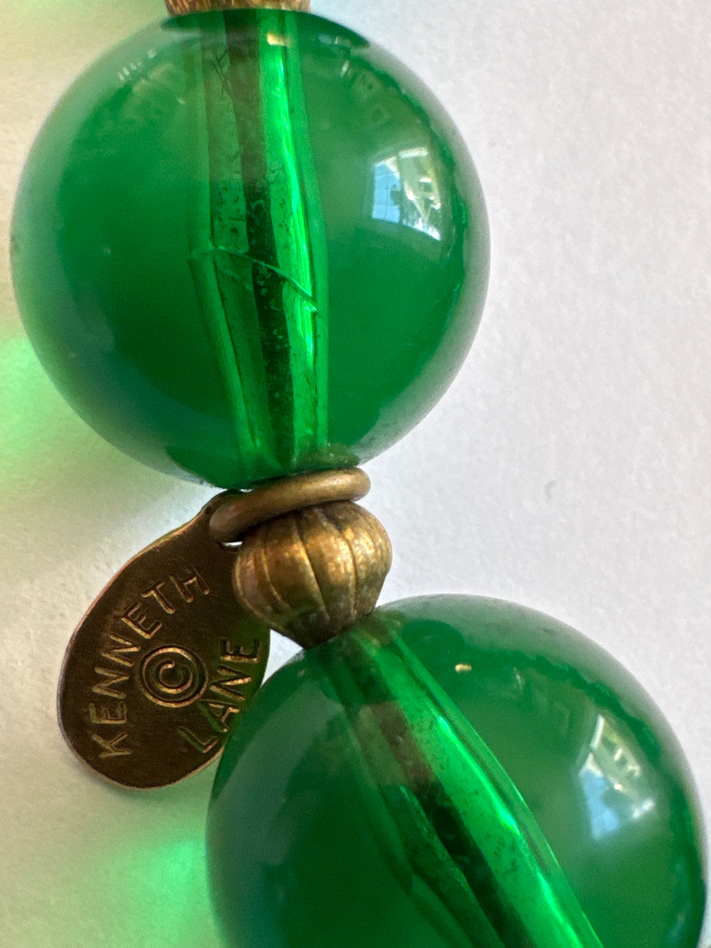Absolutely stunning signed Kenneth Lane 1970s green glass bead tassel necklace.