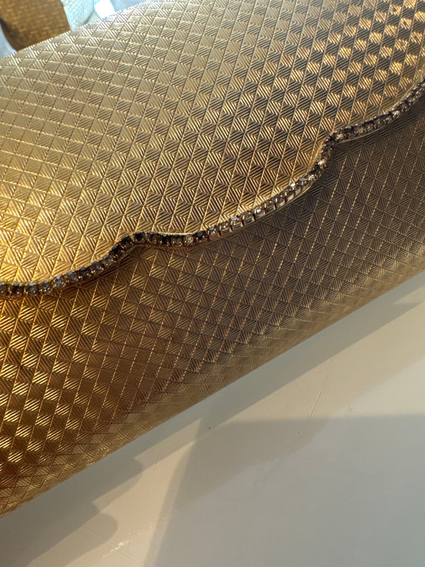 Beautiful vintage 1950s gold hardshell clutch with rhinestone detail, and mirror inside