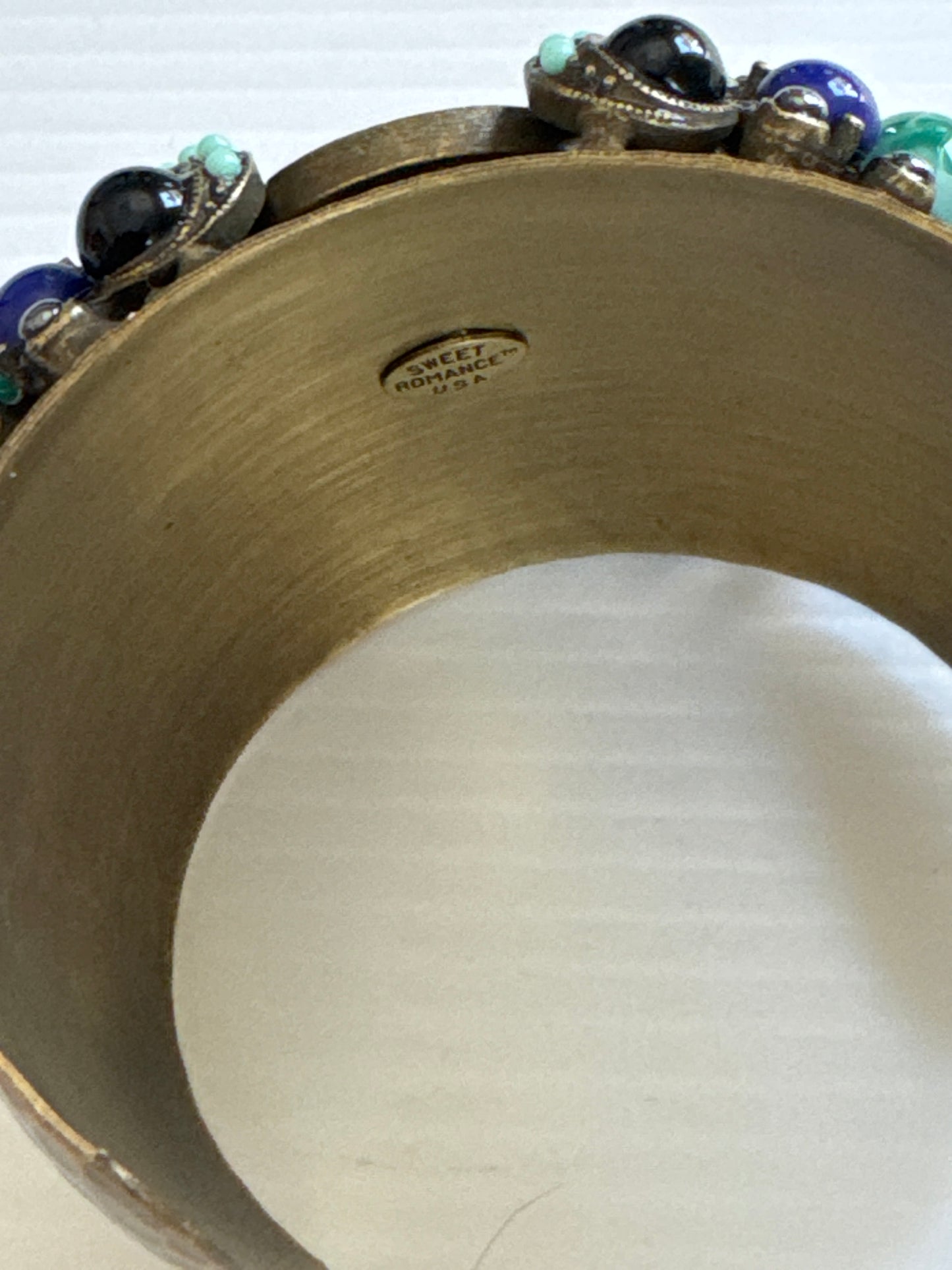 1970s beautiful signed, sweet romance cuff bracelet with colored cabochons shaping a butterfly