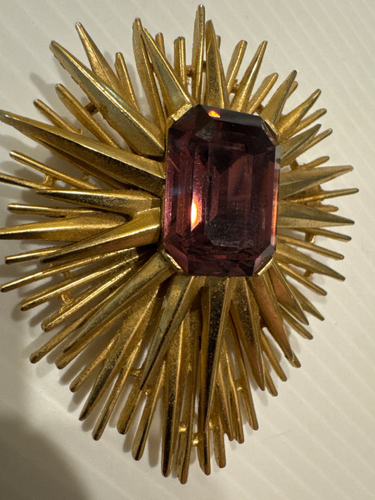 Beautiful signed Trifari Starburst brooch with emerald cut amethyst stone