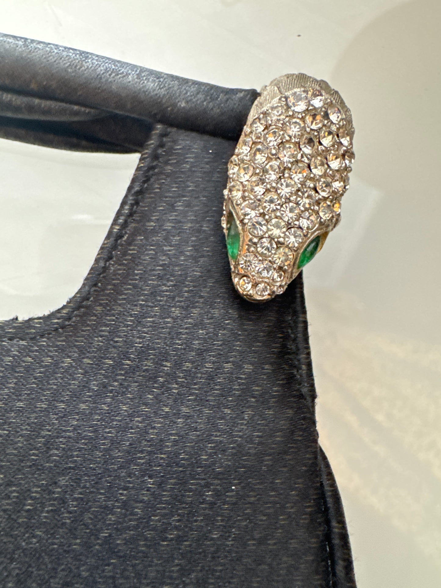 1960s stunning black vintage jeweled evening bag. Two snake heads with clear crystal rhinestones and green rhinestone eyes. Could it be a KJL design???