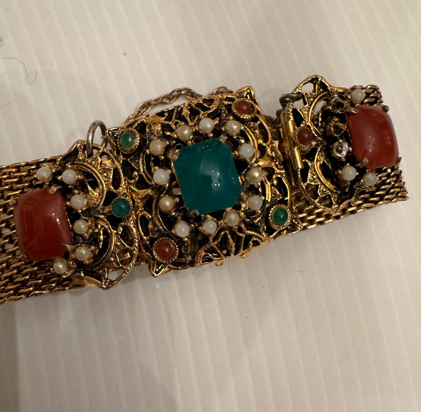 1940s gold tone mesh bracelet with pearls and stones. Safety latch.