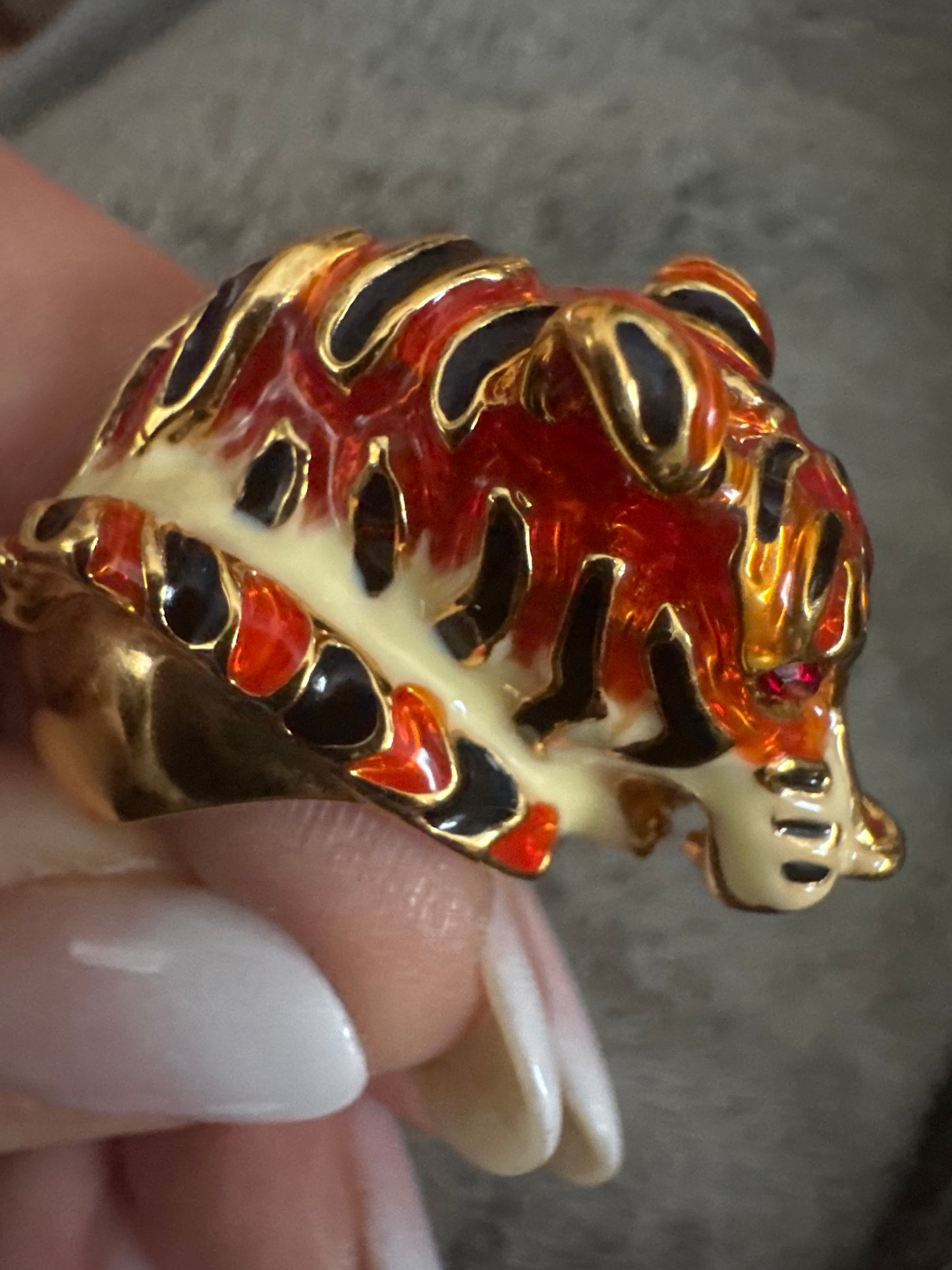 1990s enamel tiger ring with rhinestone eyes. signed KJL China.
