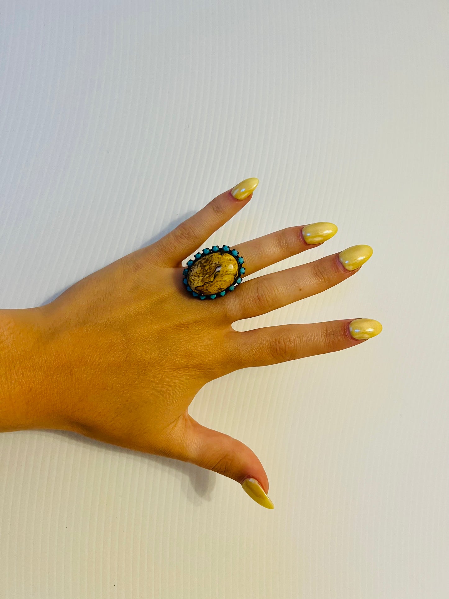 Vintage brass tone ring with turquoise rhinestones and large tan stone