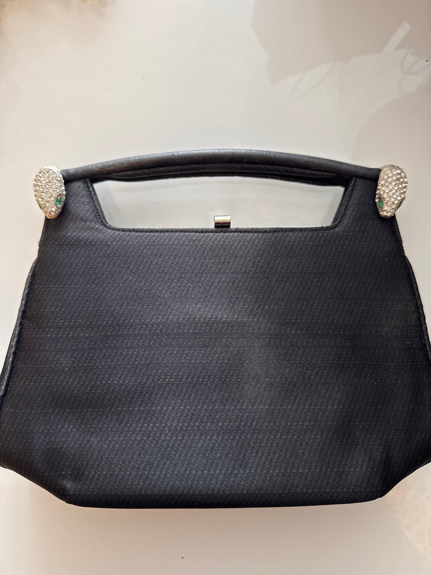 1960s stunning black vintage jeweled evening bag. Two snake heads with clear crystal rhinestones and green rhinestone eyes. Could it be a KJL design???