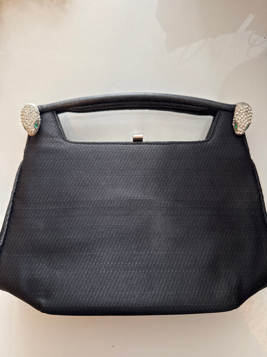 1960s stunning black vintage jeweled evening bag. Two snake heads with clear crystal rhinestones and green rhinestone eyes. Could it be a KJL design???