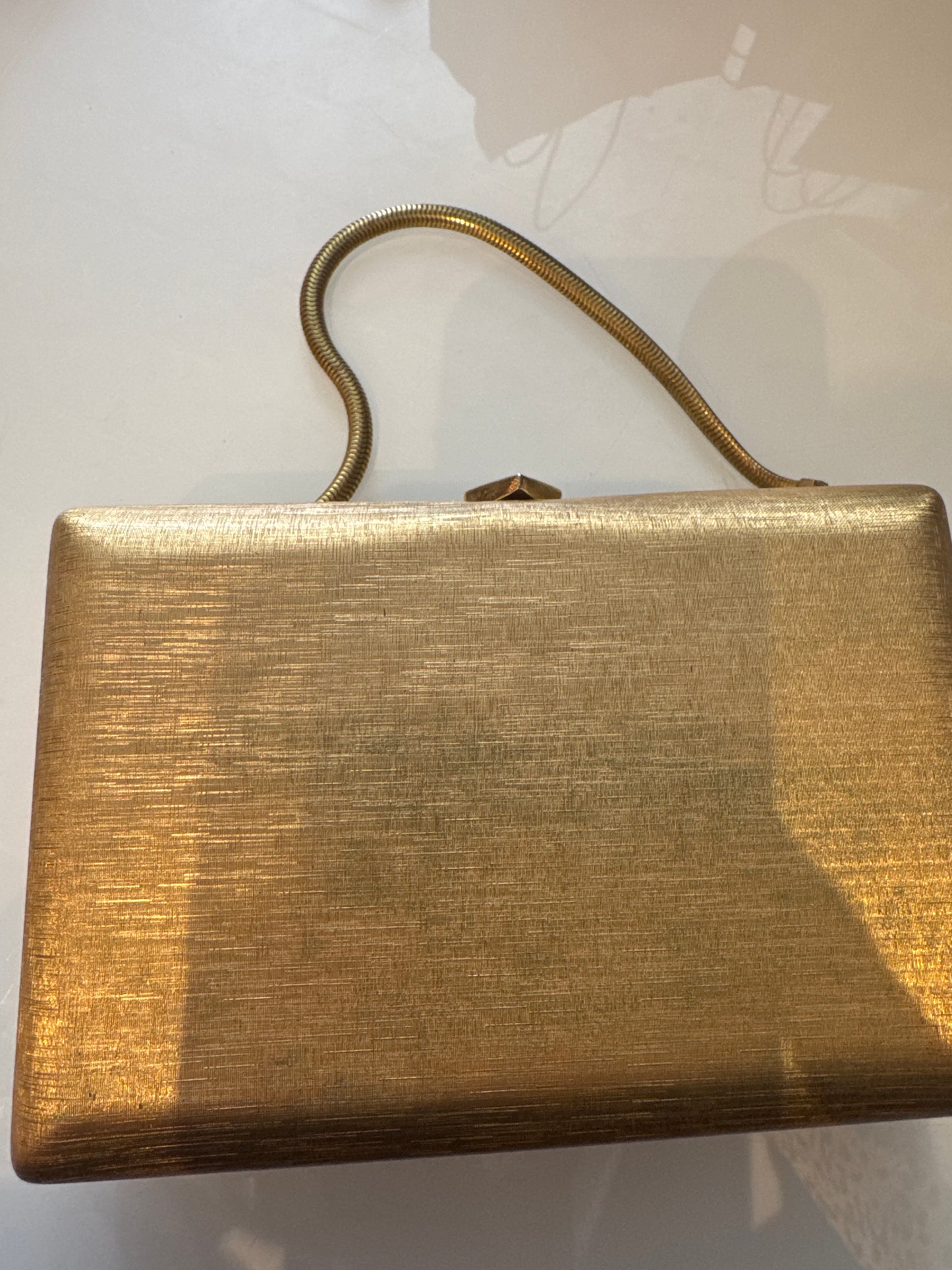 1970s lightweight hardtop gold VOLUPE box bag with gold snake chain handle. has original Alexander's price tag.