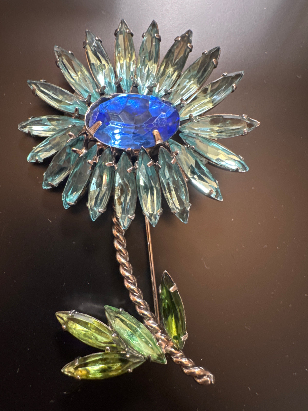 Stunning flower brooch with blue and green rhinestones
