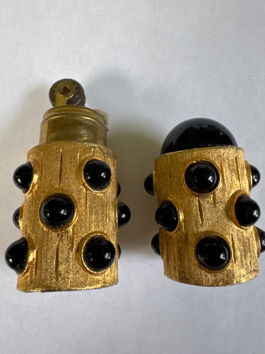 1970s signed Florenza vintage lighter in gold tone with black cabochons. Does it work? Not sure. More of a decorative conversation piece