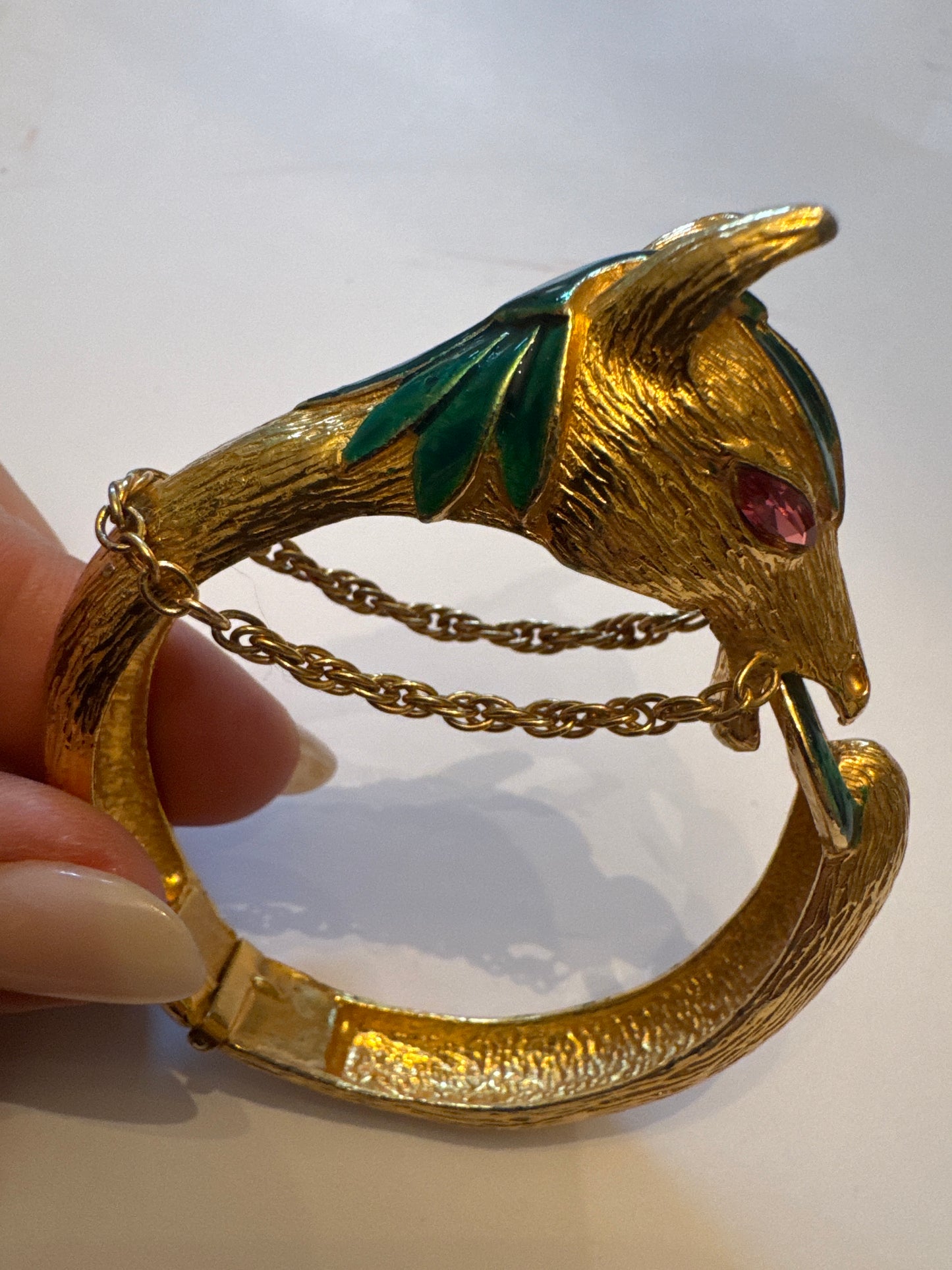 Vintage gold plate and enamel horse clamper bracelet with pink rhinestone eyes