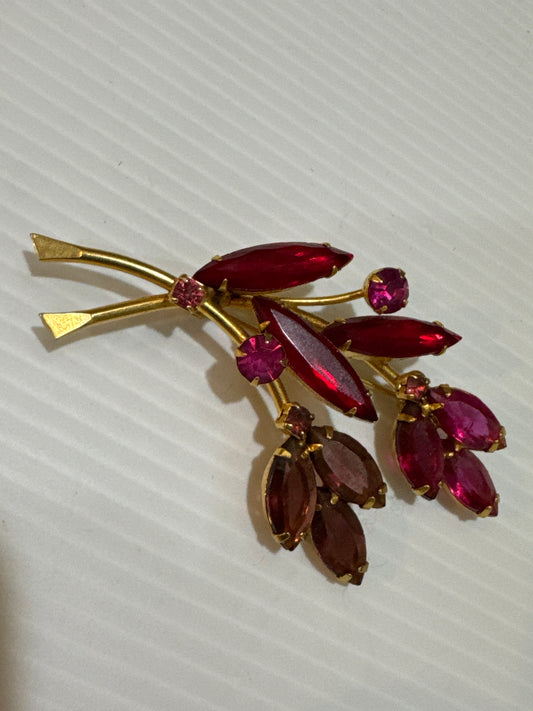 1950s beautiful red, fuchsia and amethyst colored glass rhinestone brooch. Jackpot.