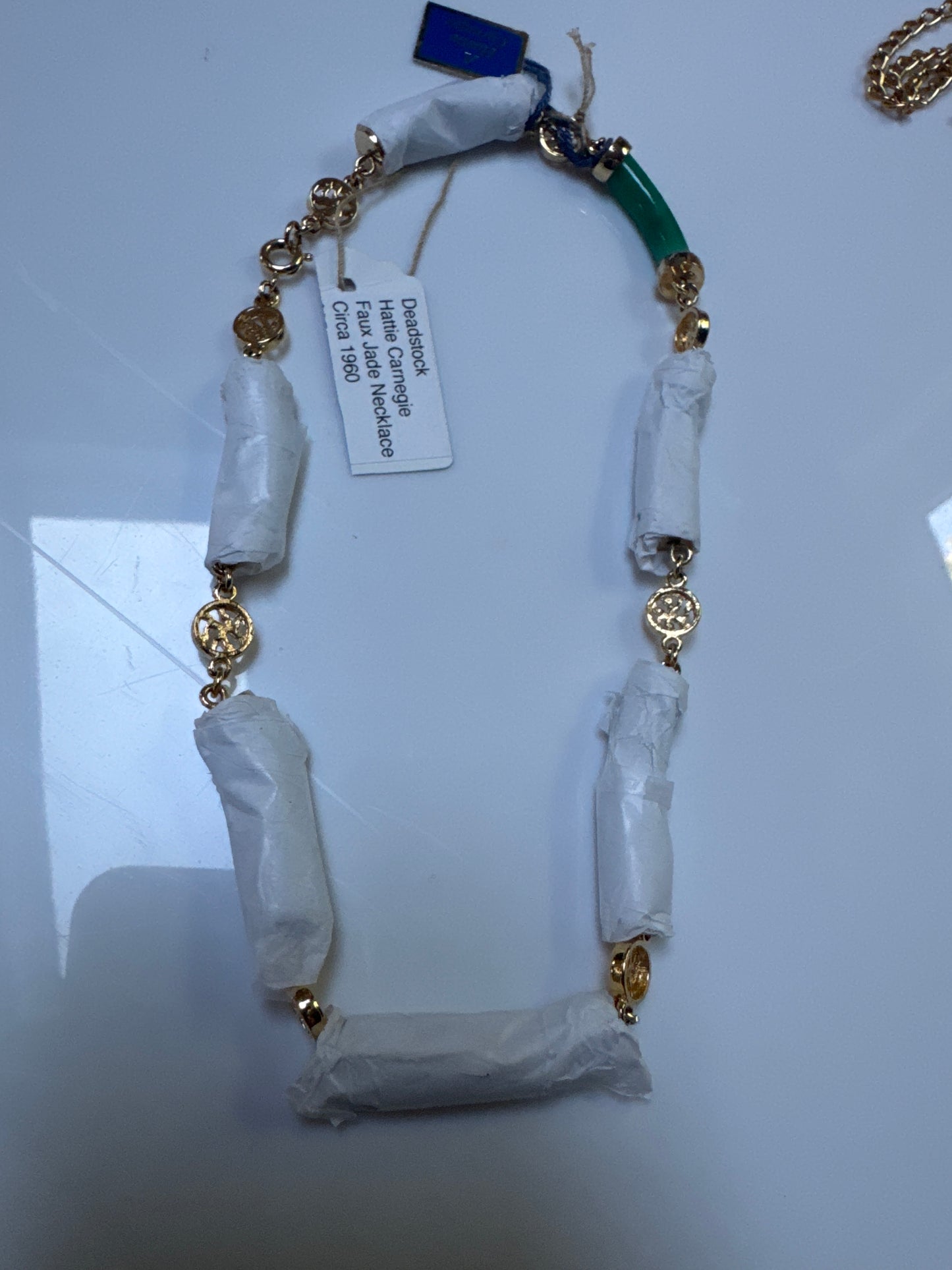 Beautiful vintage HATTIE CARNEGIE faux jade necklace circa 1960. Comes with original tag and is still wrapped. Ready to ship.