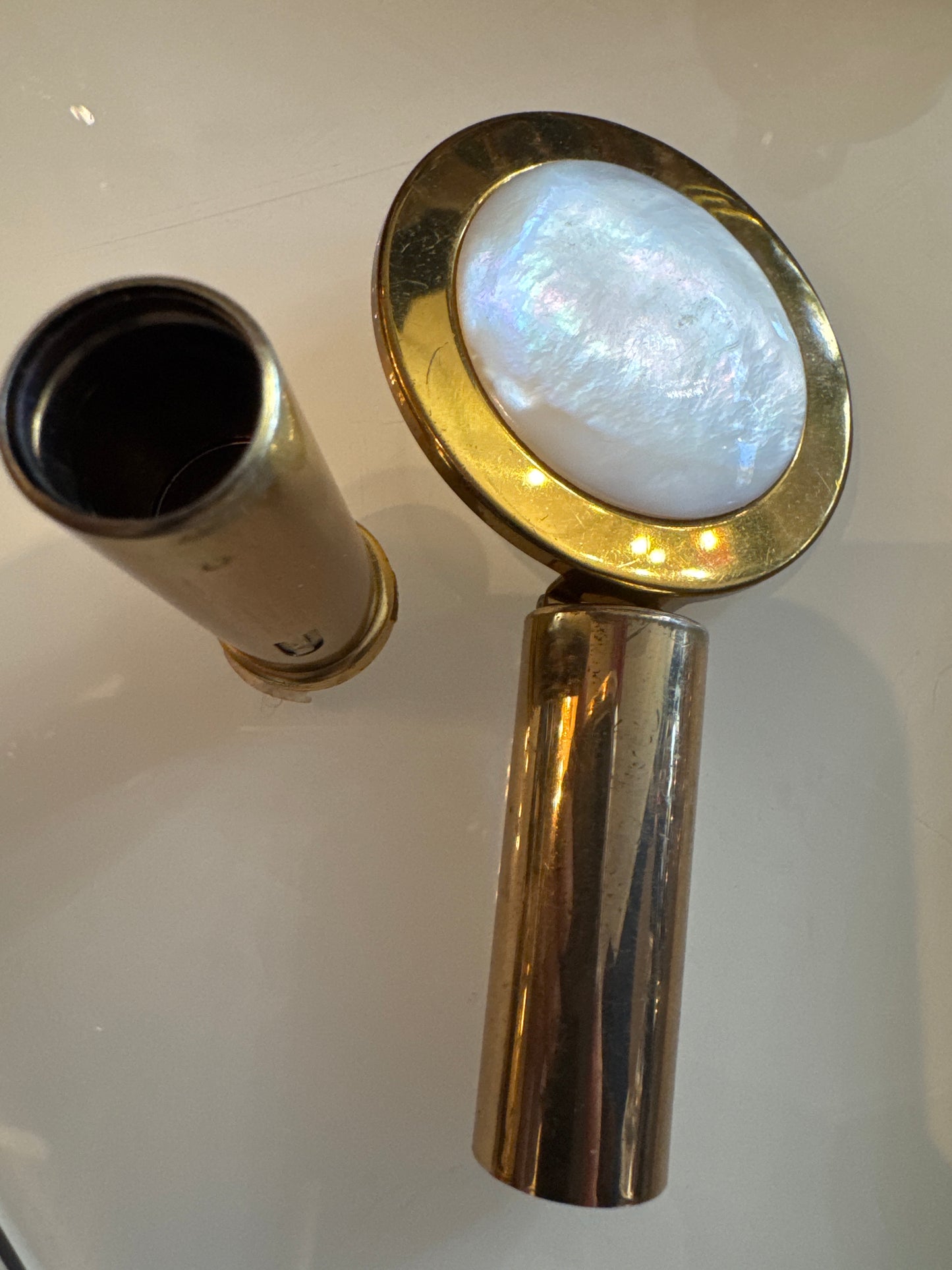 vintage refillable lipstick holder with mirror. Folds up.