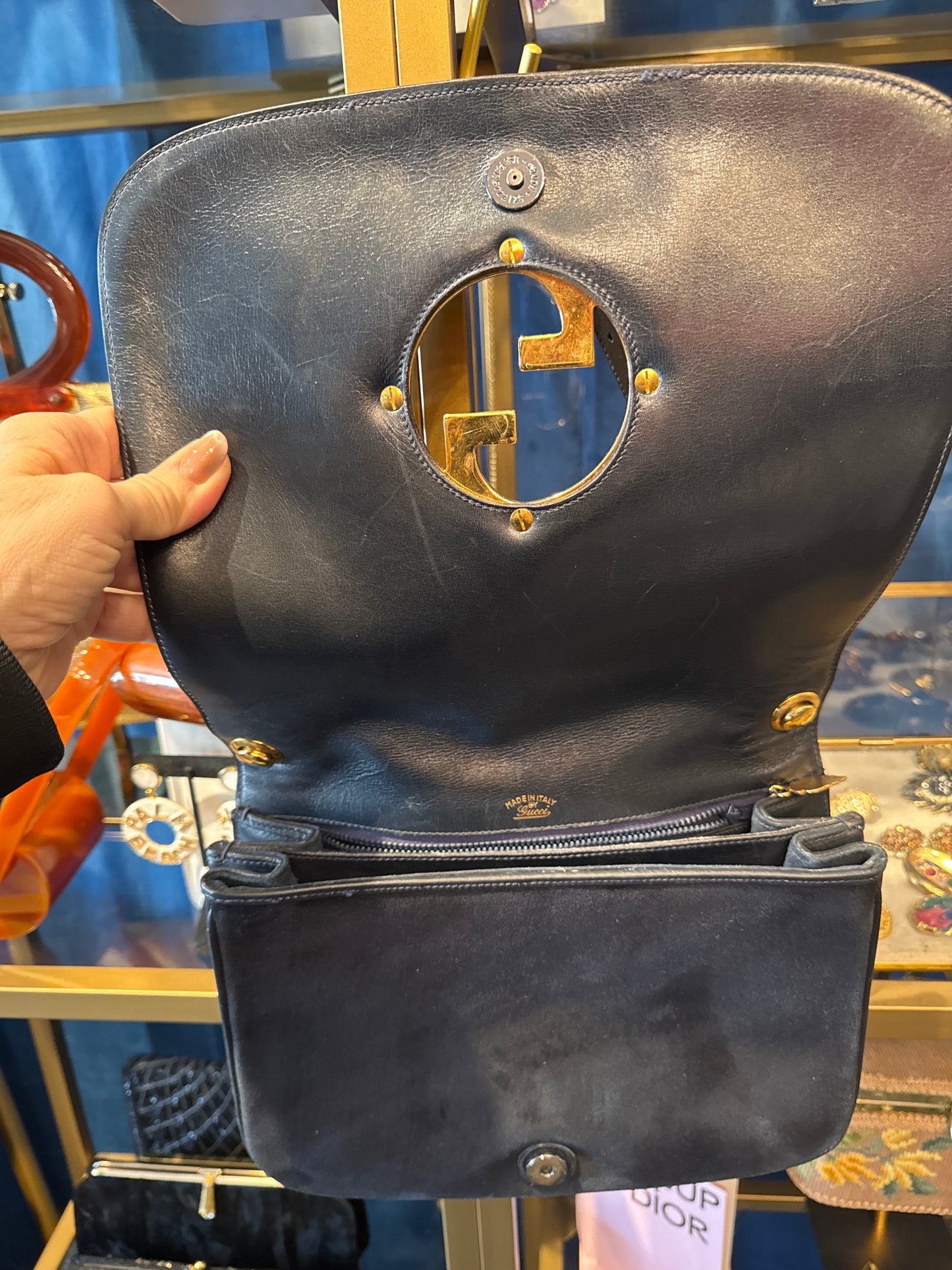 An original 1970s Gucci Blondie bag in midnight blue suede with gold double GG. Snap closure recently replaced.