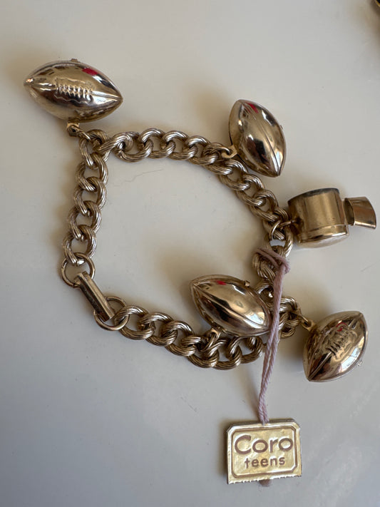 adorable, gold tone football charm bracelet with whistle signed Coro with original tag. so chic