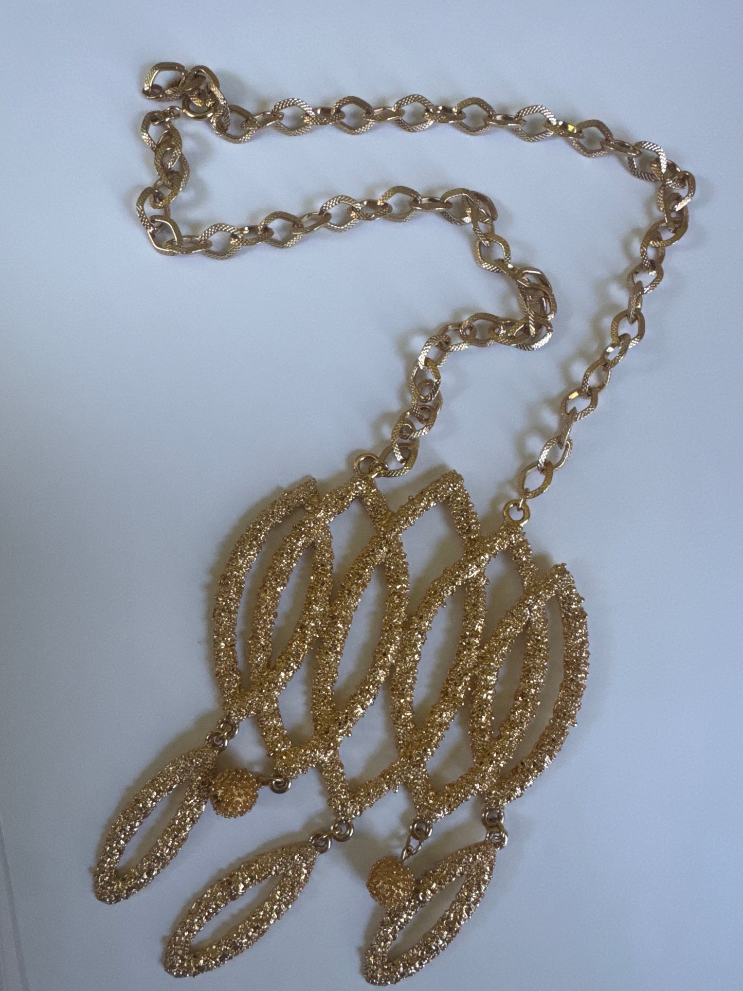 Fabulous large vintage 1971 NAPIER by Francis Fujio champagne bubbles necklace. Heavily gold plated metal with raised textured metal surface referred to as champagne bubbles. Large statement book piece