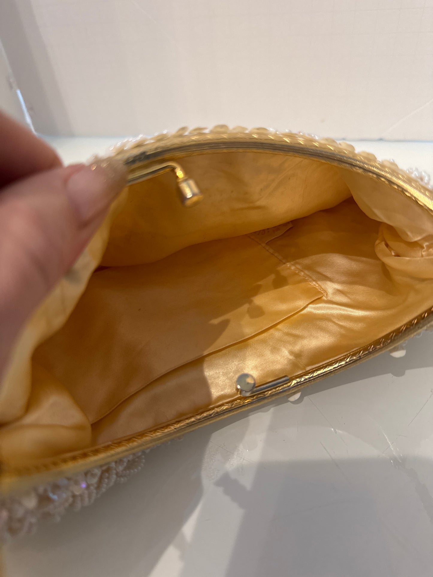 1950s white beaded kiss lock bag with gold bracelet handle