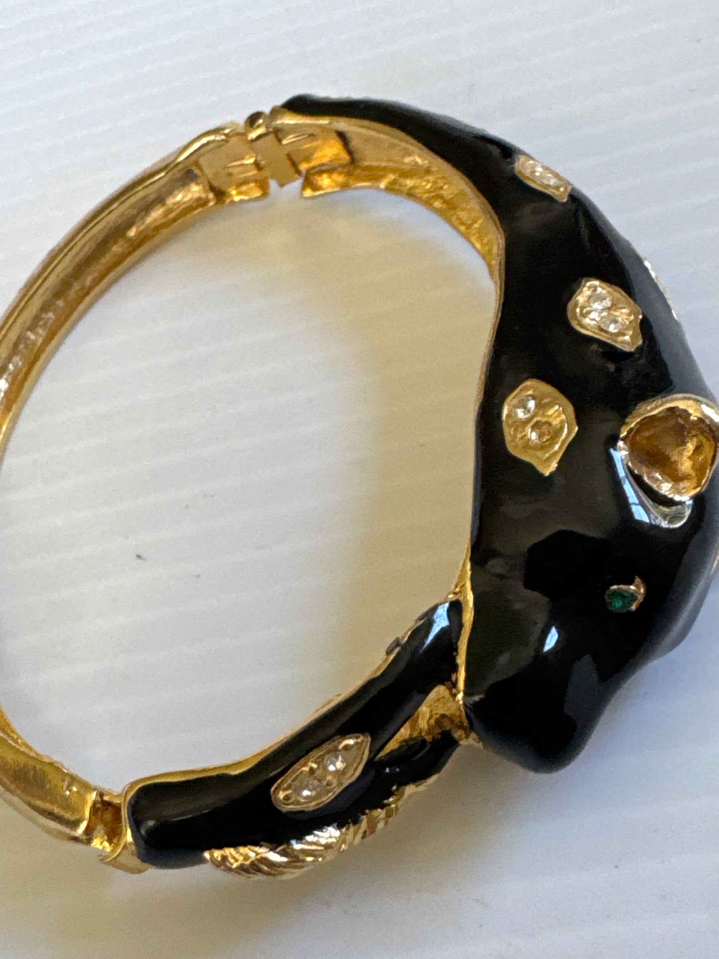 1980s vintage panther bracelet with black enamel, green rhinestone eyes and clear rhinestones