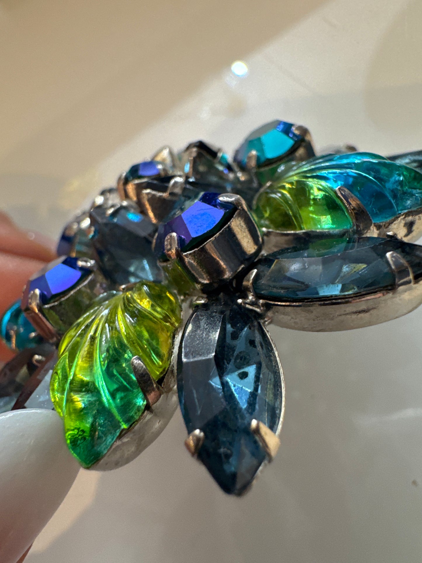 Beautiful green and blue rhinestone brooch with aurora borealis