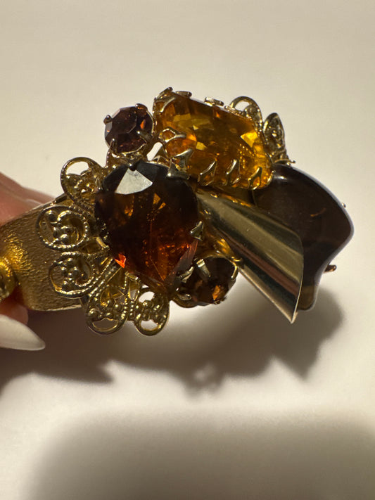 Beautiful 1950s rushed gold clamper cuff bracelet with topaz and Amber colored rhinestones