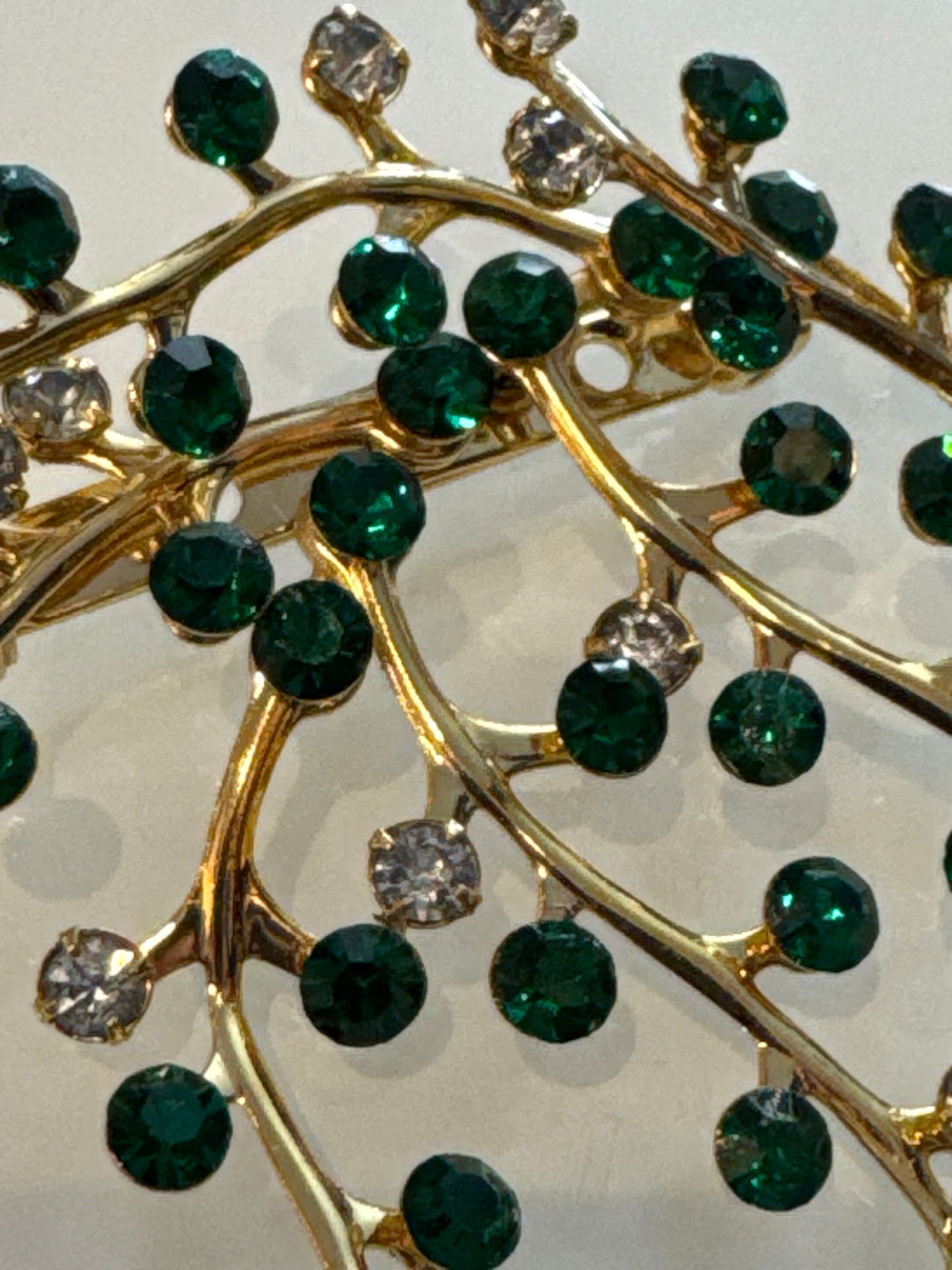 Beautiful unsigned, green and clear rhinestone branch brooch. Stones are super sparkly.