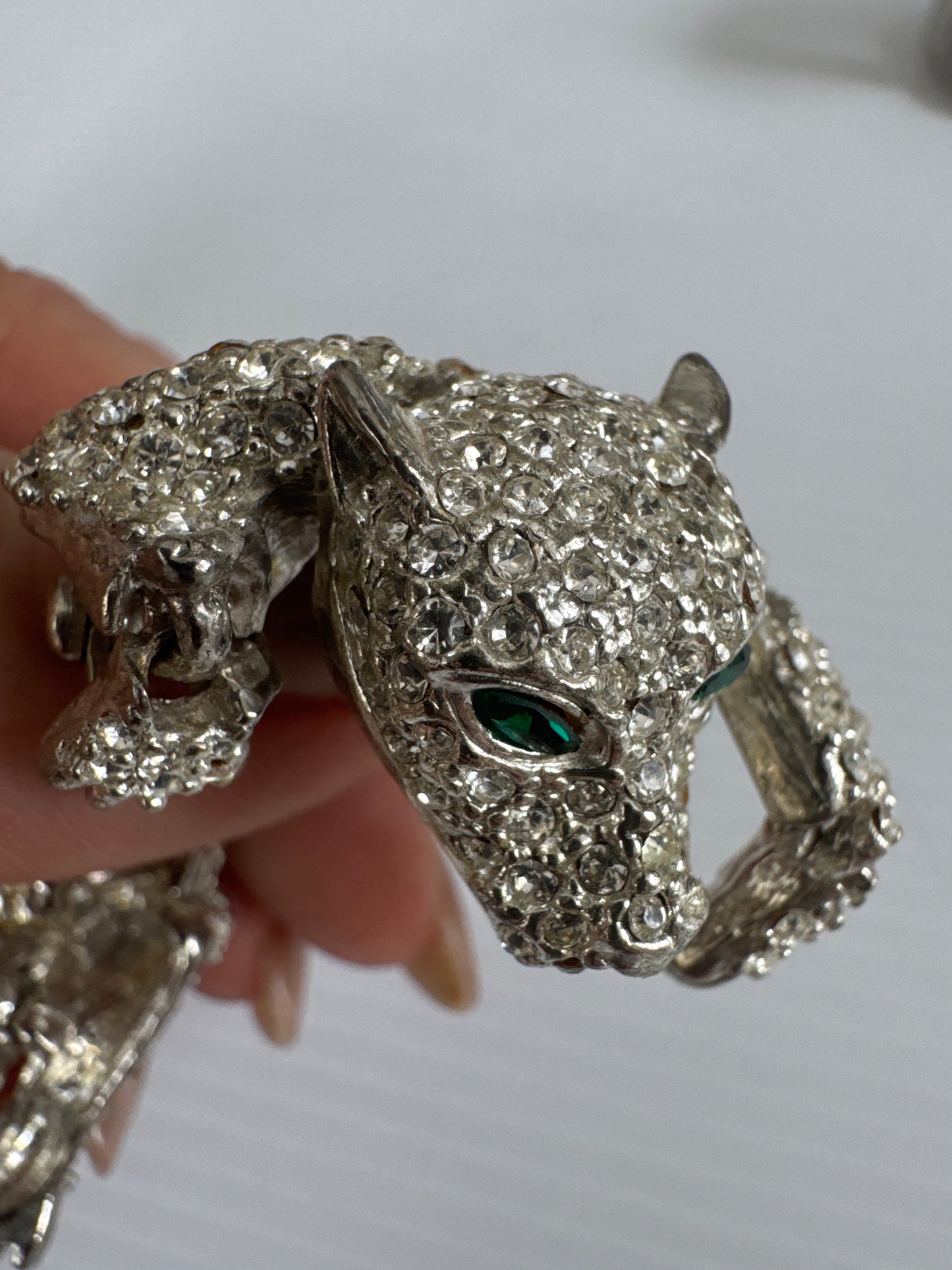 1950s beautiful crystal rhinestone articulated cheetah shoulder brooch with green emerald colored eyes