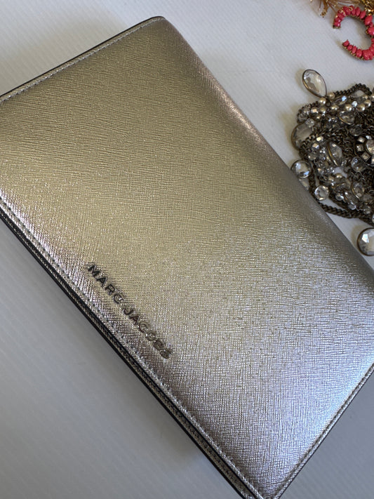 Never worn 1990s Marc Jacob's silver leather clutch with optional strap. Zippered interior and credit card slots plus a small back pocket.