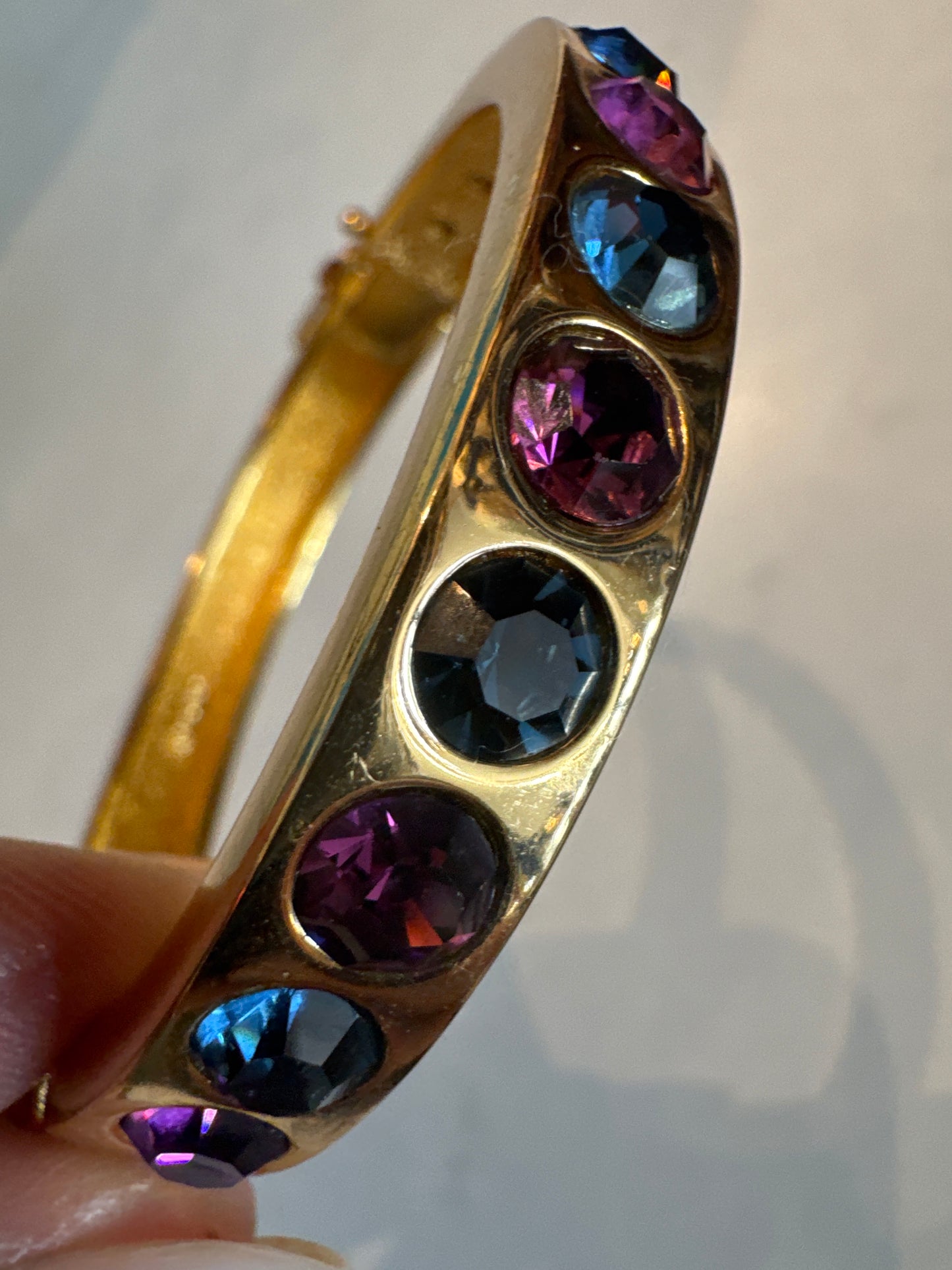 Beautiful 1990s vintage Dior clamper bracelet with blue and purple rhinestones and safety latch