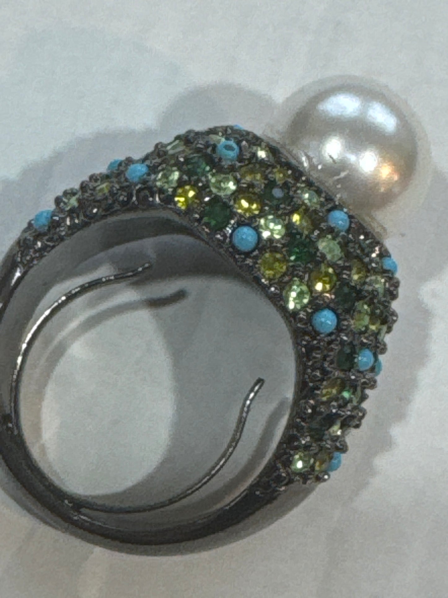 Stunning vintage KJL cocktail ring with green colored rhinestones, turquoise stones and a jumbo center pearl
