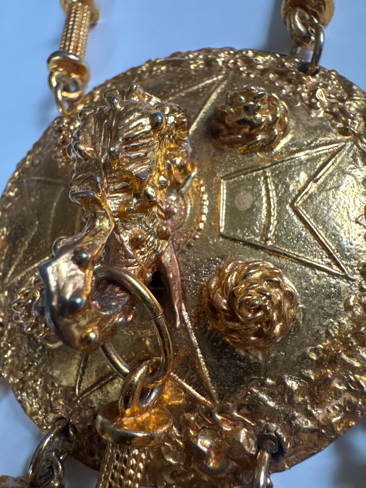 Signed 1960s Pauline Rader signed gold tone necklace. The two elephant heads that dangle at the bottom of the pendant are hollow. Double chains on each side. It's heavy!