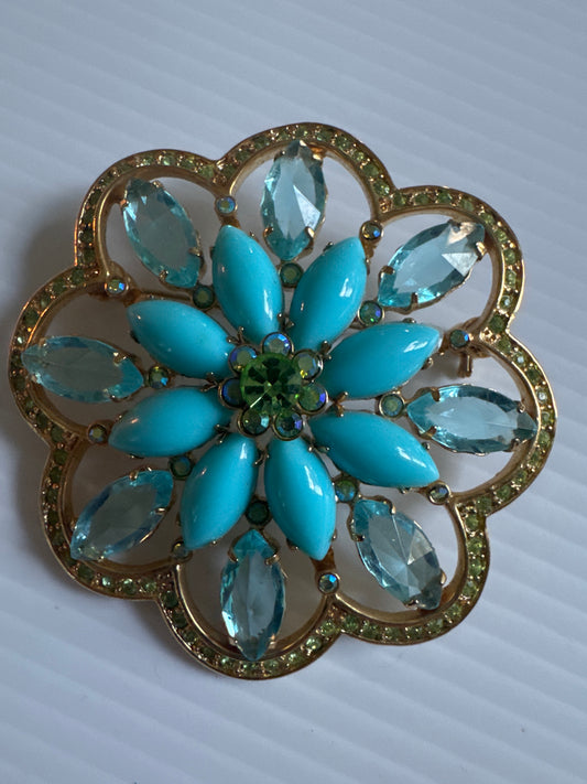 1970s gold tone brooch with turquoise cabochon and green rhinestones