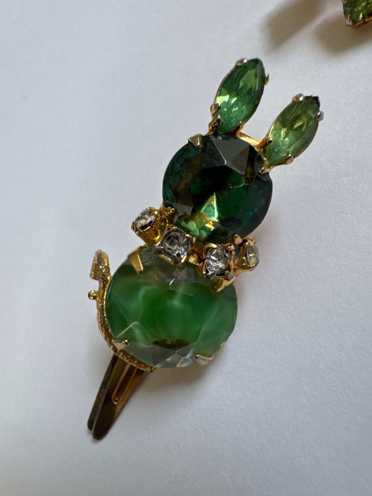 A rare mid-century Czech figural mouse clip, featuring apple greenhand-set glass stones and whimsical post-war design