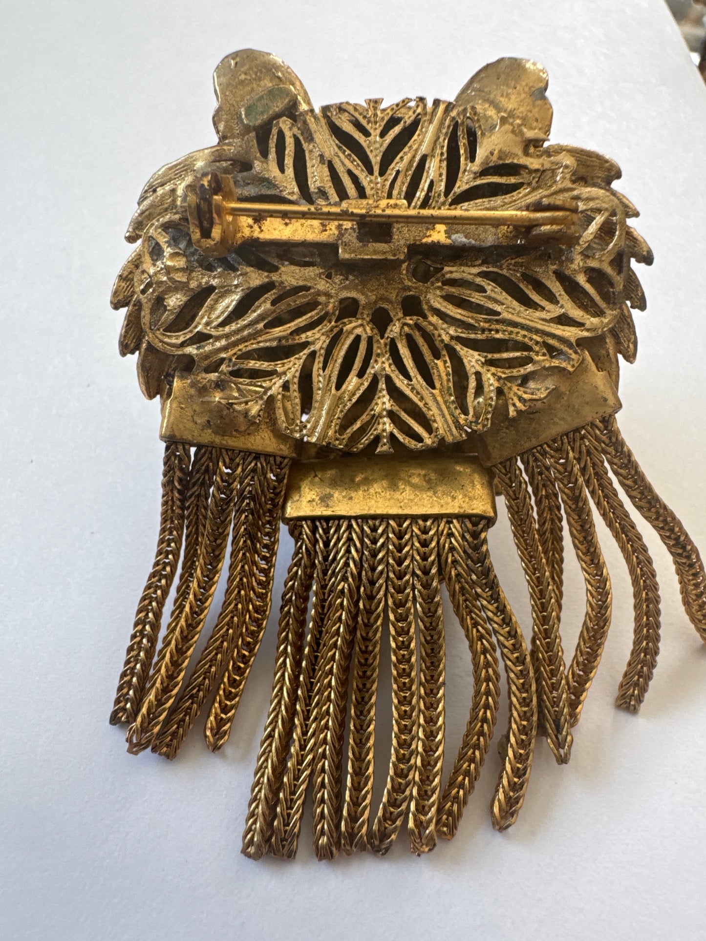Coveted and hard to find 1960s unsigned lionhead tassel brooch attributed to Pauline Rader ~ this one being an amber glass cabochon with green rhinestone eyes. The wonderful coil fringe lions mane is fabulous.