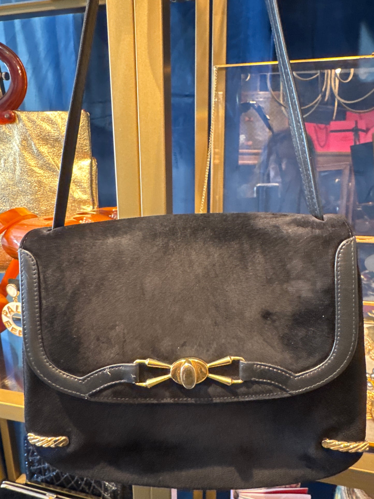 Stunning 1970s black suede with gold hardware shoulder bag. RARE and unique.