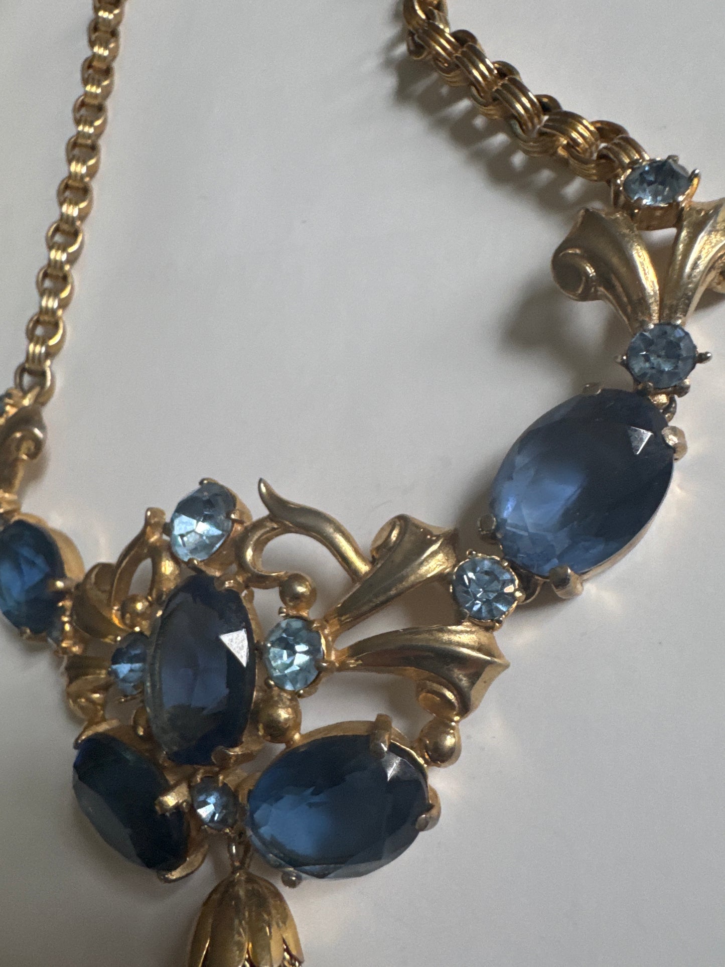 Absolutely gorgeous 1930s signed Schiaparelli necklace featuring shades of blue glass beads with tassel dangle, and J clasp closure