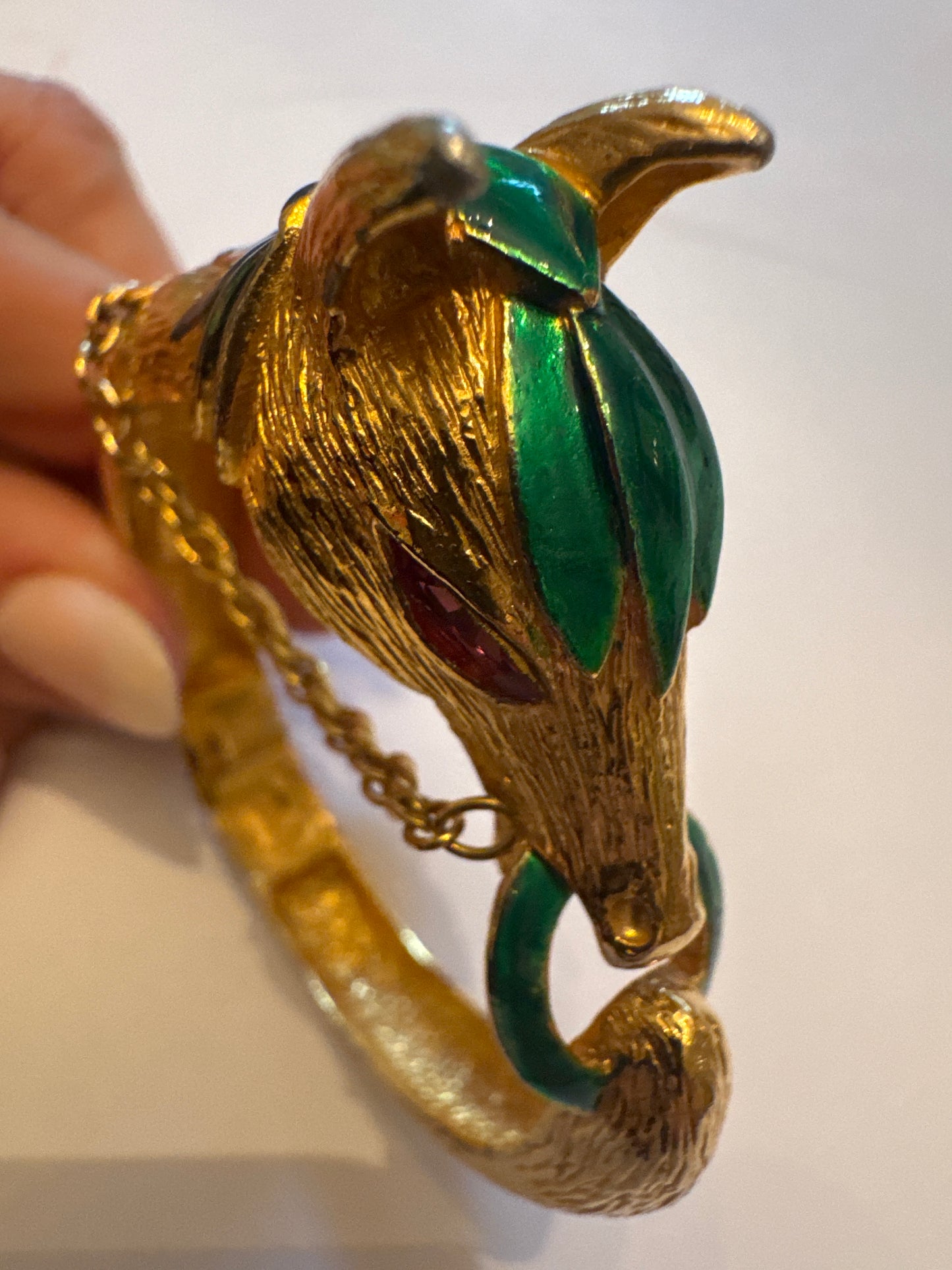 Vintage gold plate and enamel horse clamper bracelet with pink rhinestone eyes