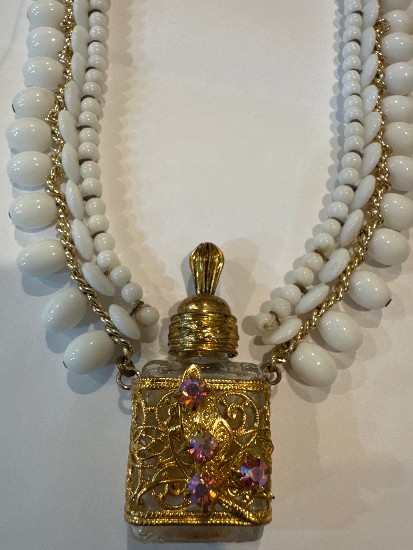 Beautiful 1940s/50s made in western Germany fragrance bottle necklace with white glass beads. Has original tag.