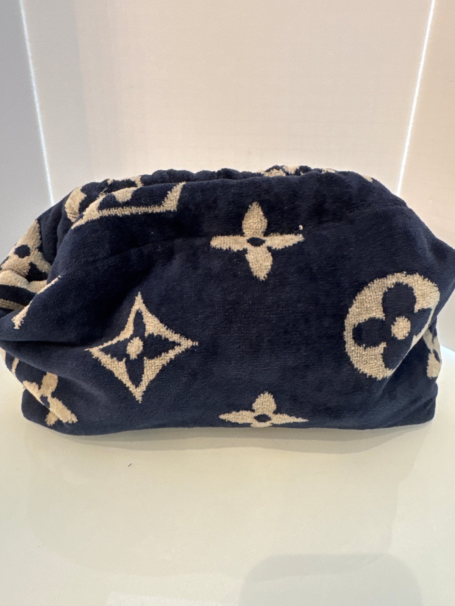 Vintage designer towel reimagined into a clutch/crossbody bag.