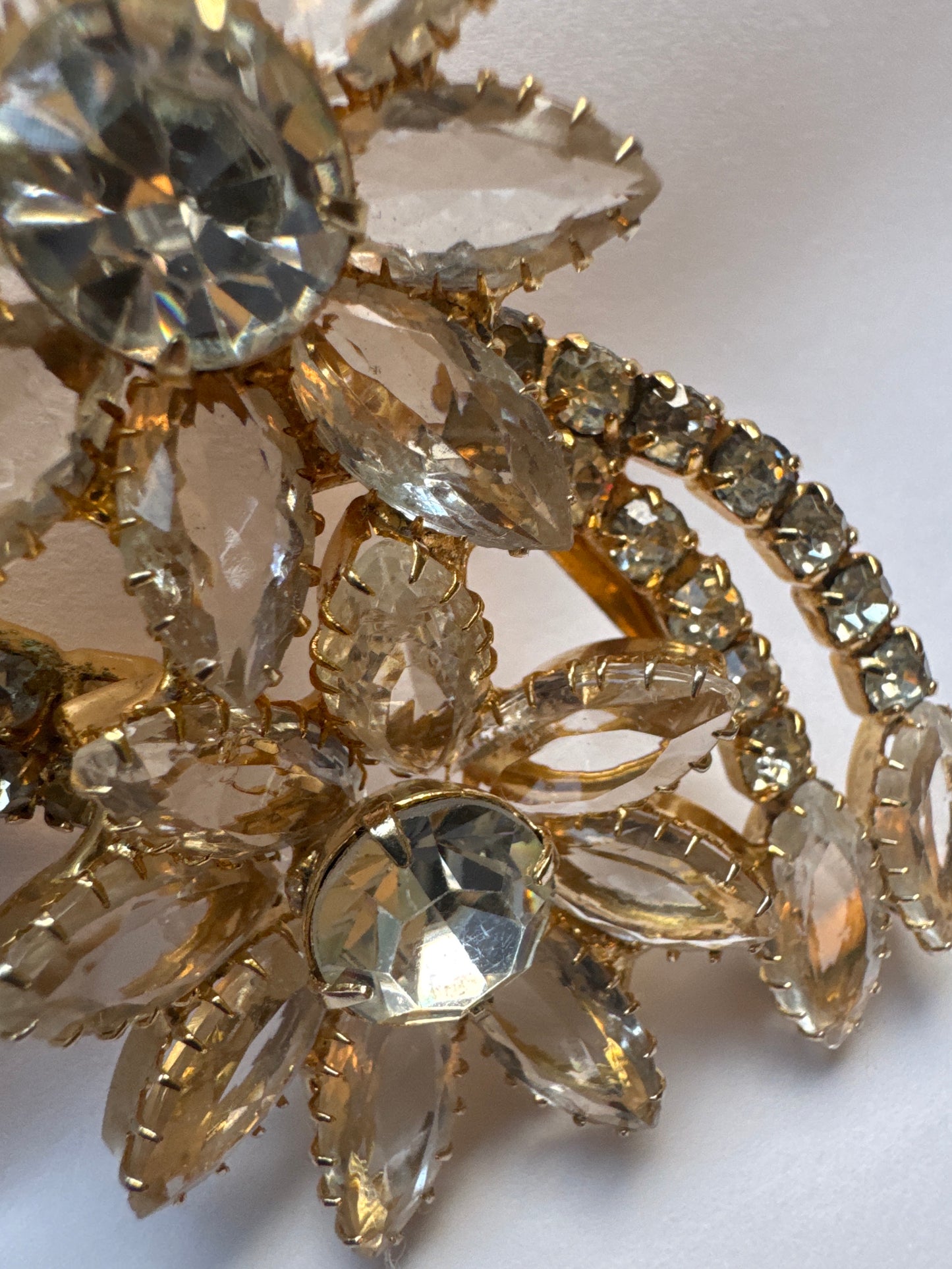 Beautiful vintage floral spray, gold tone and clear navette brooch
