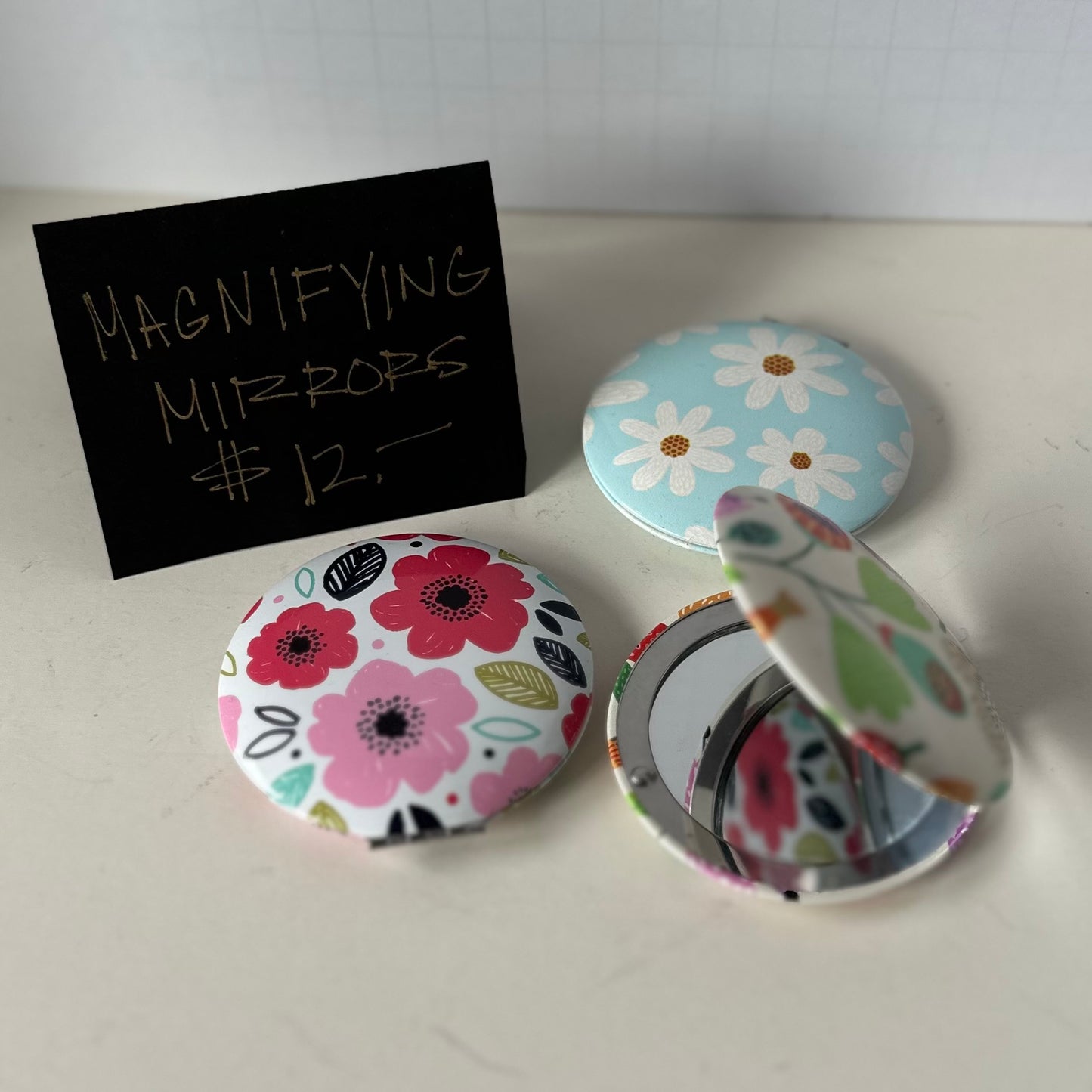 Magnifying Compact Mirrors