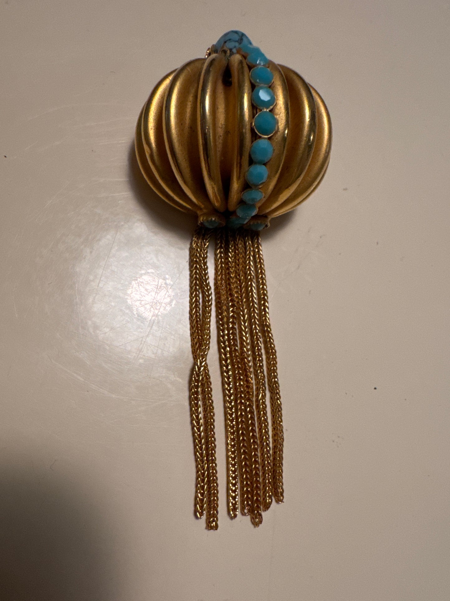 vintage 1960s gold tone brooch with tassel, dangle, and turquoise stones. Summer