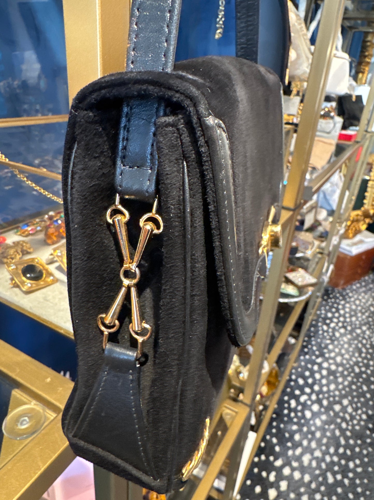 Stunning 1970s black suede with gold hardware shoulder bag. RARE and unique.